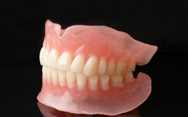 A full set of dentures on a table 