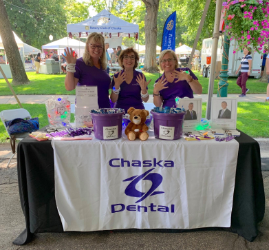 Chaska dental team members at community event booth