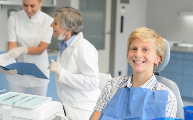 Child smiling during visit to children's dentist