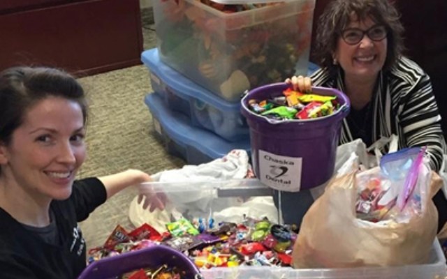 Two dental team members at 2017 Halloween candy buyback