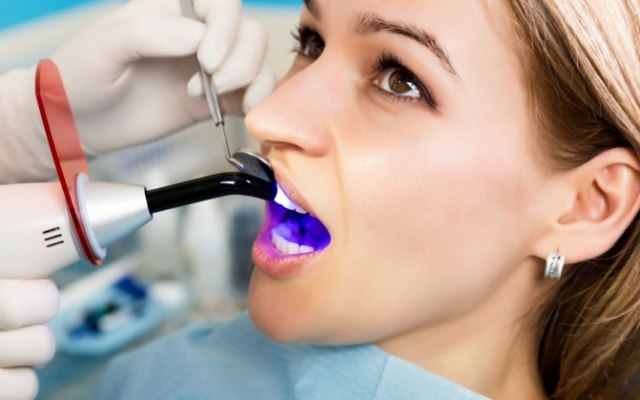 Woman receiving cosmetic dental bonding