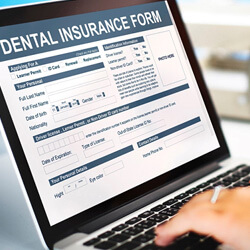 person filling out paperwork