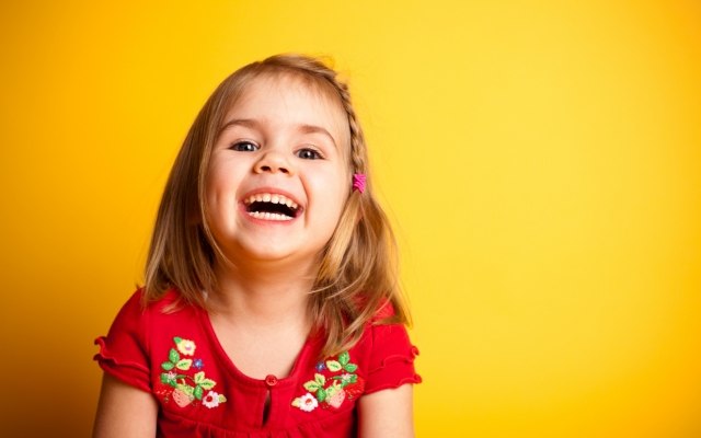 Young girl smiling after teeth cleaning