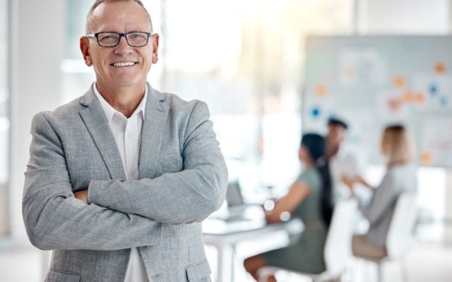 Man wearing dentures and working