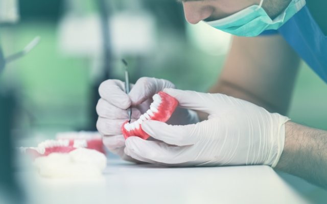 Dental technician crafting a dental restoration