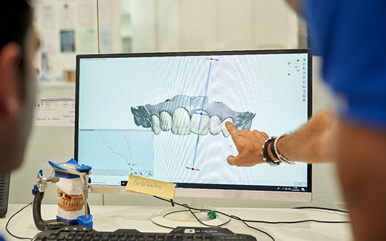 Dentist evaluating a digital scan of a patient’s mouth