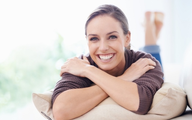 Woman sharing beautiful smile after gum lift