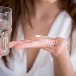 Person taking an antibiotic