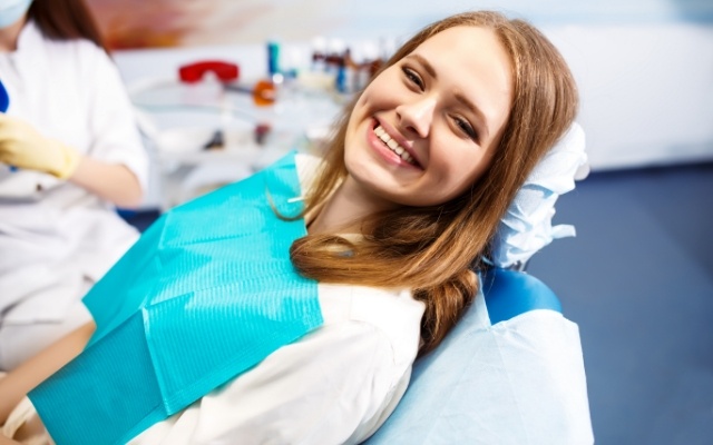 Woman smiling after periodontal therapy