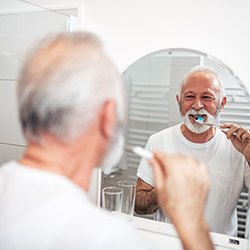 Man brushing teeth in Chaska