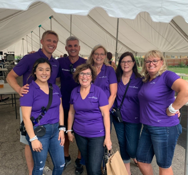 Chaska dental team members wearing matching shirts at community event