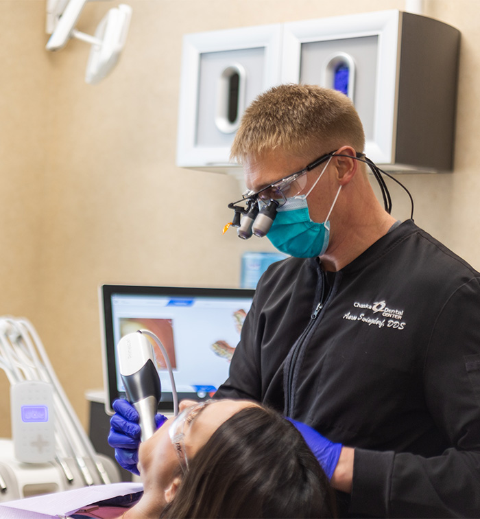 Chaska dentist talking to female dental patient