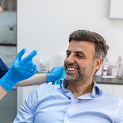 Man learning how much Invisalign will cost