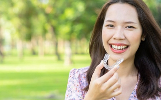 Young woman smiling with Invisalign in Chaska