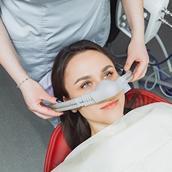 Woman having nasal mask placed