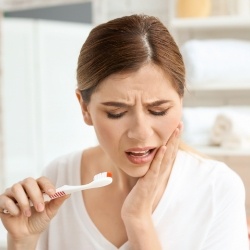 Woman in pain before visiting her sedation dentist