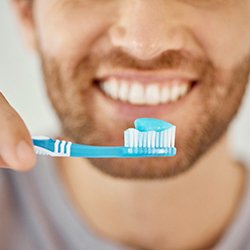 Man getting ready to brush his teeth