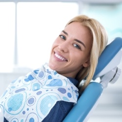 Woman with ceramic dental restoration smiling