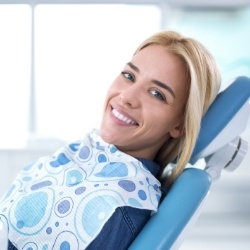 Woman with ceramic dental restoration smiling