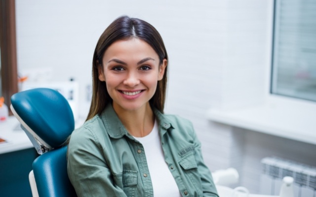 Woman smiling during smile makeover consultation