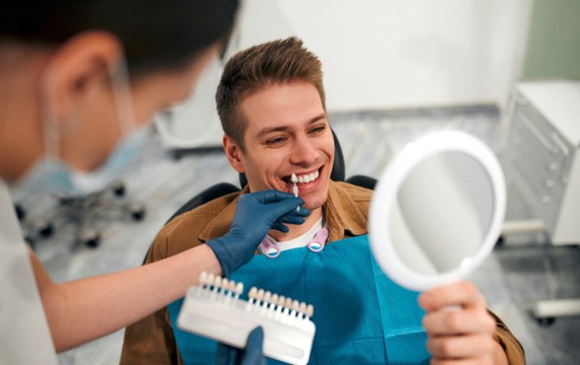 Man learning about veneers in Chaska