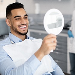 Man smiling after receiving veneers in Chaska