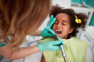 little girl at the dentist