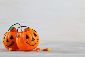 overflowing halloween bucket with candy