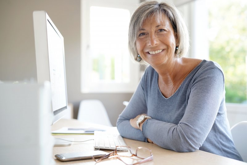 woman working after dental implant surgery